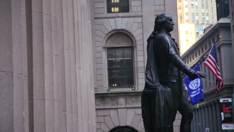 Pan-right-from-columns-to-a-statue-on-Wall-Street-in-New-York-City
