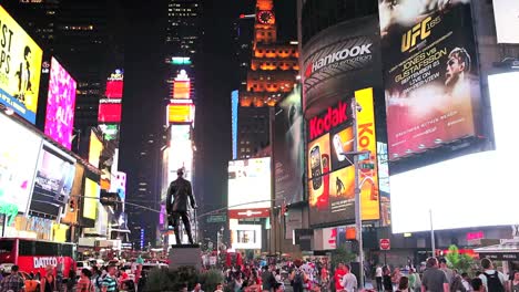 Times-Square-lit-up-and-crowded-at-night-1