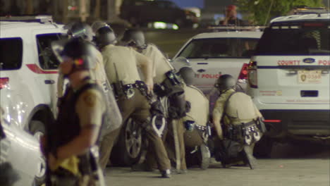 Police-in-heavy-military-riot-gear-prepare-to-confront-protestors-in-Ferguson-Missouri-1