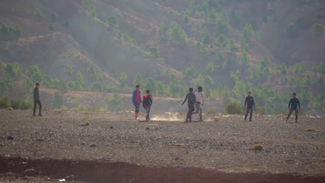 African-children-play-soccer-on-a-dirt-field