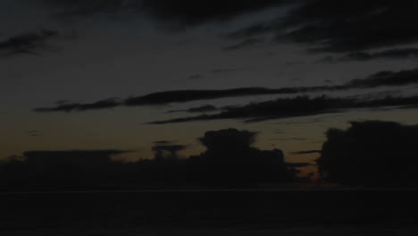 Time-lapse-clouds-move-across-the-sky-above-the-ocean