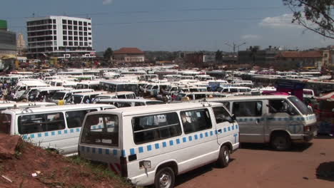 Medium-shot-time-lapse-of-a-busy-bus-depot-in-Kampala-Uganda