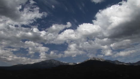Clouds-move-above-a-desert-mountain-range