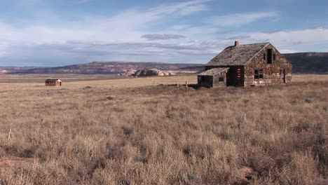 Long-shot-of-an-abandoned-homestead-on-a-lonely-prairie
