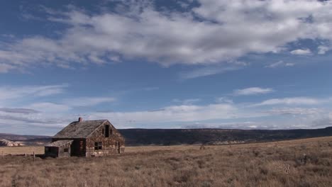 Long-shot-of-an-old-abandoned-homestead-on-a-lonely-prairie