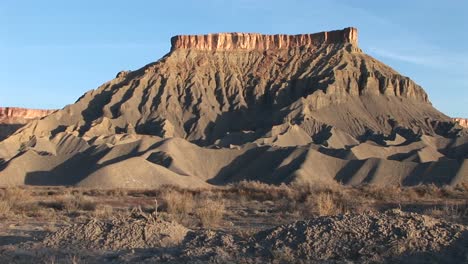 Long-shot-of-a-magnificent-desert-formation-that-looks-like-a-fortress