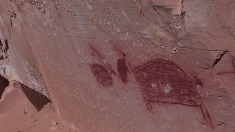 Panright-slowly-across-the-face-of-a-cliff--to-an-American-Indian-pictograph