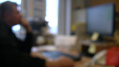 Man-Behind-Office-Desk