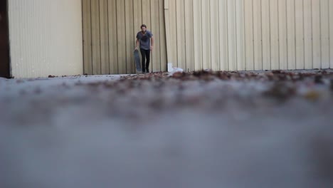 Skateboarder-Rolling-Through-Leaves