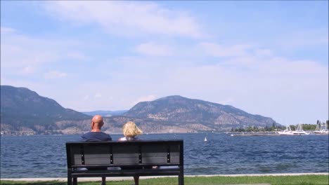 Couple-Sitting-by-the-Lake