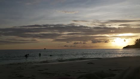 People-Taking-a-Bath-at-Sunset