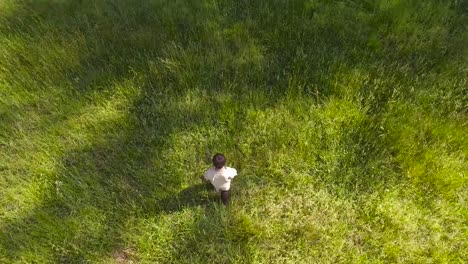 Child-Walking-Through-Field-into-Forest