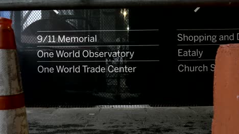 People-Walking-past-the-911-Memorial-Sign-in-New-York