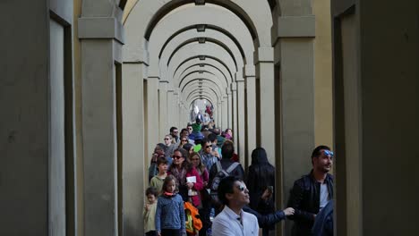 Tourists-Walking-Under-Arches