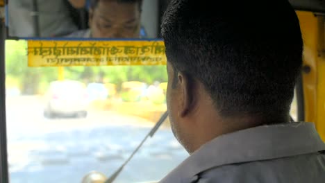 Handheld-Shot-of-a-Tuk-Tuk-Driver