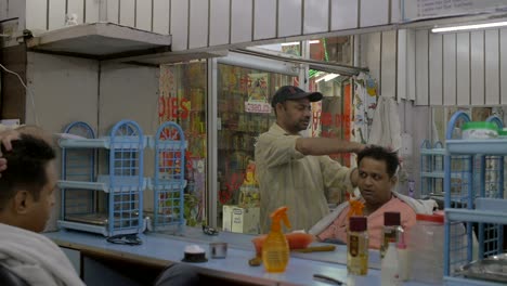 Man-Styling-Clients-Hair-in-Barber-Shop