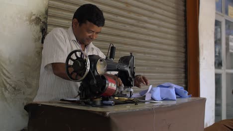 Man-Ironing-Blue-Cuts-of-Fabric