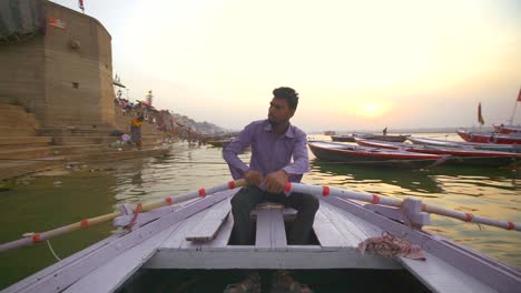 Man-Rowing-Boat-on-Ganges-at-Sunset