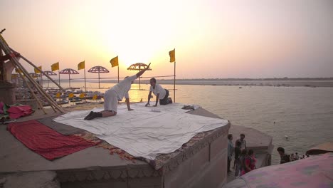 People-Doing-Yoga-In-front-of-River-Ganges