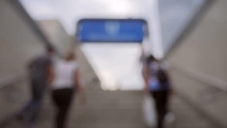 Out-of-Focus-Shot-of-People-Leaving-Train-Station