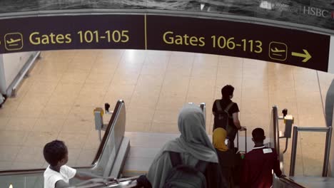 Mother-and-Son-Heading-To-Departure-Gate-at-Airport