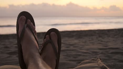 POV-Shot-of-Feet-on-a-Beach