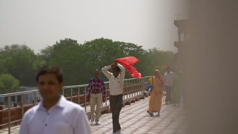 Indian-Man-Covering-Head-With-Red-Shawl