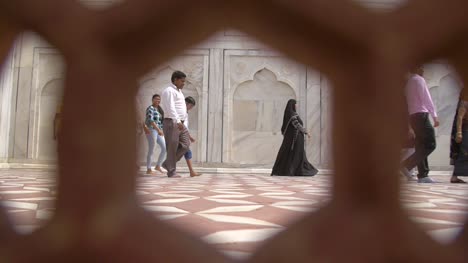 Shot-of-Woman-in-a-Niqab-Through-a-Stone-Grate