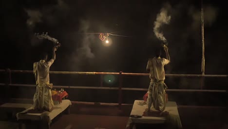 Two-Men-Performing-the-Ganga-Aarti-Ceremony