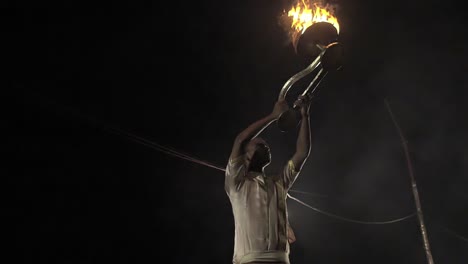 Indian-Man-Lifts-Up-Ceremonial-Candles