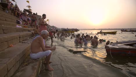 Man-Washing-Metal-Jug-by-the-Ganges