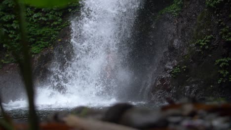 Man-Jumping-into-a-Waterfall