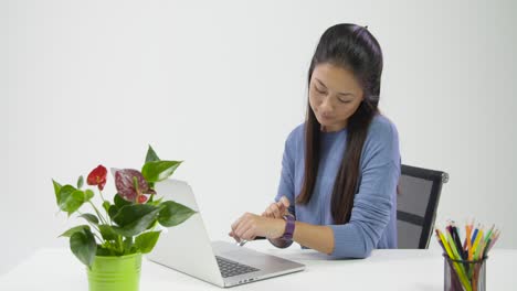 Tracking-Past-Young-Lady-Checking-Fitbit