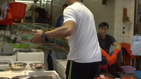 Carrying-Fresh-Seafood-at-Hong-Kong-Market