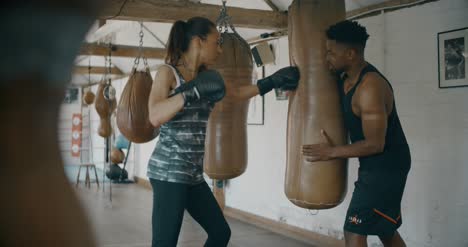 Man-and-Woman-Training-in-Boxing-Gym