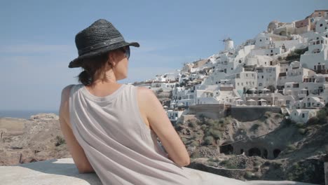 Tracking-Past-Tourist-Overlooking-Small-Greek-Town