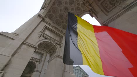 Belgian-Flag-Under-Triumphal-Arch-in-Brussels