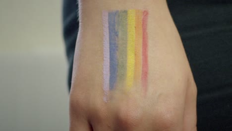 Tracking-Away-from-Pride-Flag-on-Hand