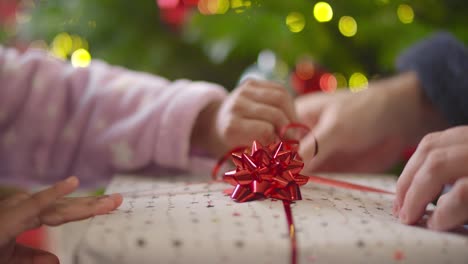 Closeup-of-Hands-Unwrapping-Present-Part-1