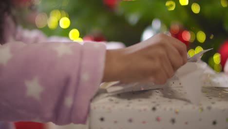 Closeup-of-Hands-Unwrapping-Present-Part-3