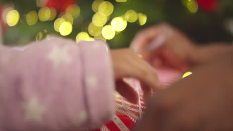 Mother-and-Child-Unwrapping-Present