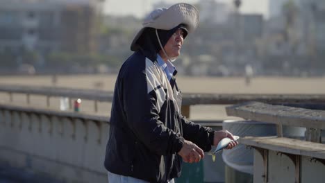 Fisherman-Carrying-Live-Fish