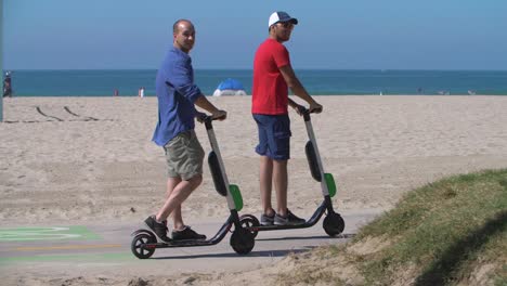 Men-on-Electric-Scooters-at-Venice-Beach