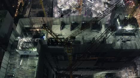 Rising-Over-Construcción-Site-Cranes