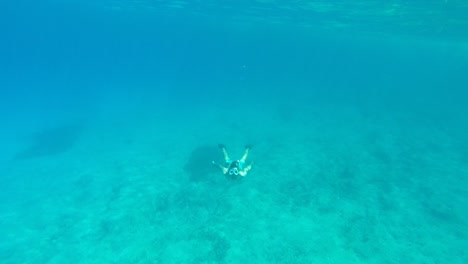 Man-Snorkelling-in-Clear-Blue-Sea