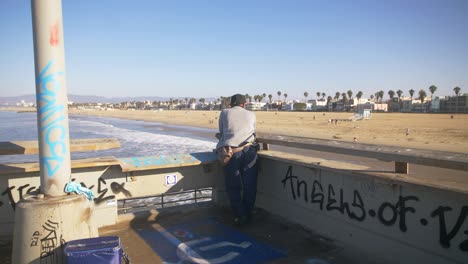 Man-Overlooking-Venice-Beach