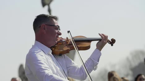 Busker-Playing-Violin-In-Slow-Motion