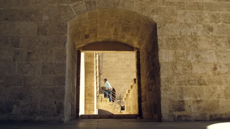 Climbing-Stairs-through-Stone-Doorway