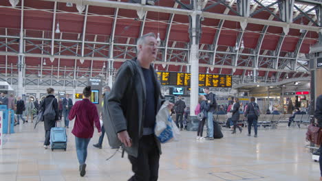 Commuters-walk-through-busy-Paddington-Station-in-slow-motion