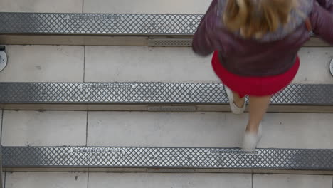 People-walking-up-stairway-from-overhead